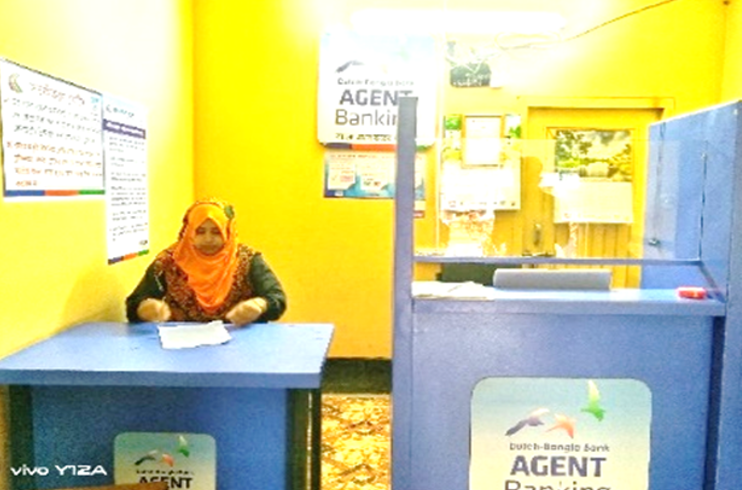 Asifa, pictured, at a desk in in office.