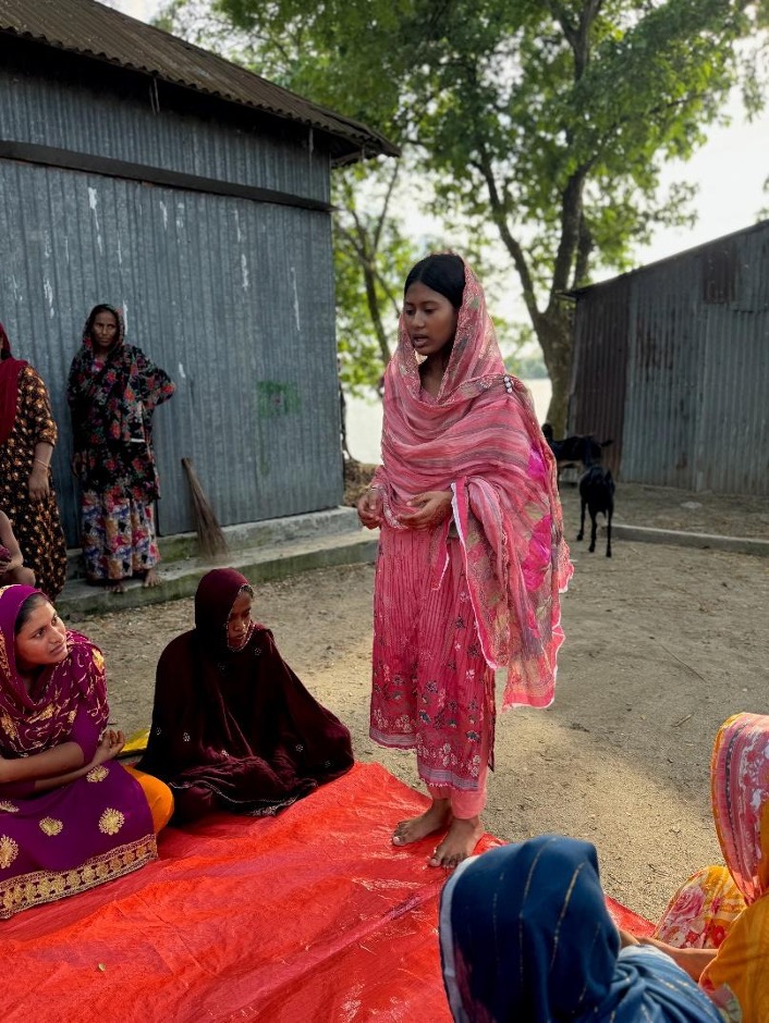 Ayesha speaking to a group on women and girls.